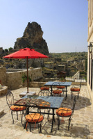 Outdoor tables - View on Cappadocia old rock castle